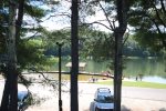 lake with swimming area and playground